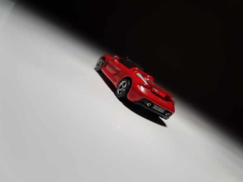 Illustration for article titled Makeitfit Monday: Rennsport Reunion Edition - Malibu International 1:87 Porsche Carrera GT